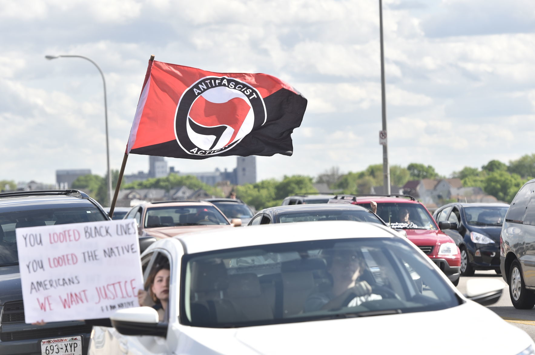 Antifacist Action flag flies above protest
